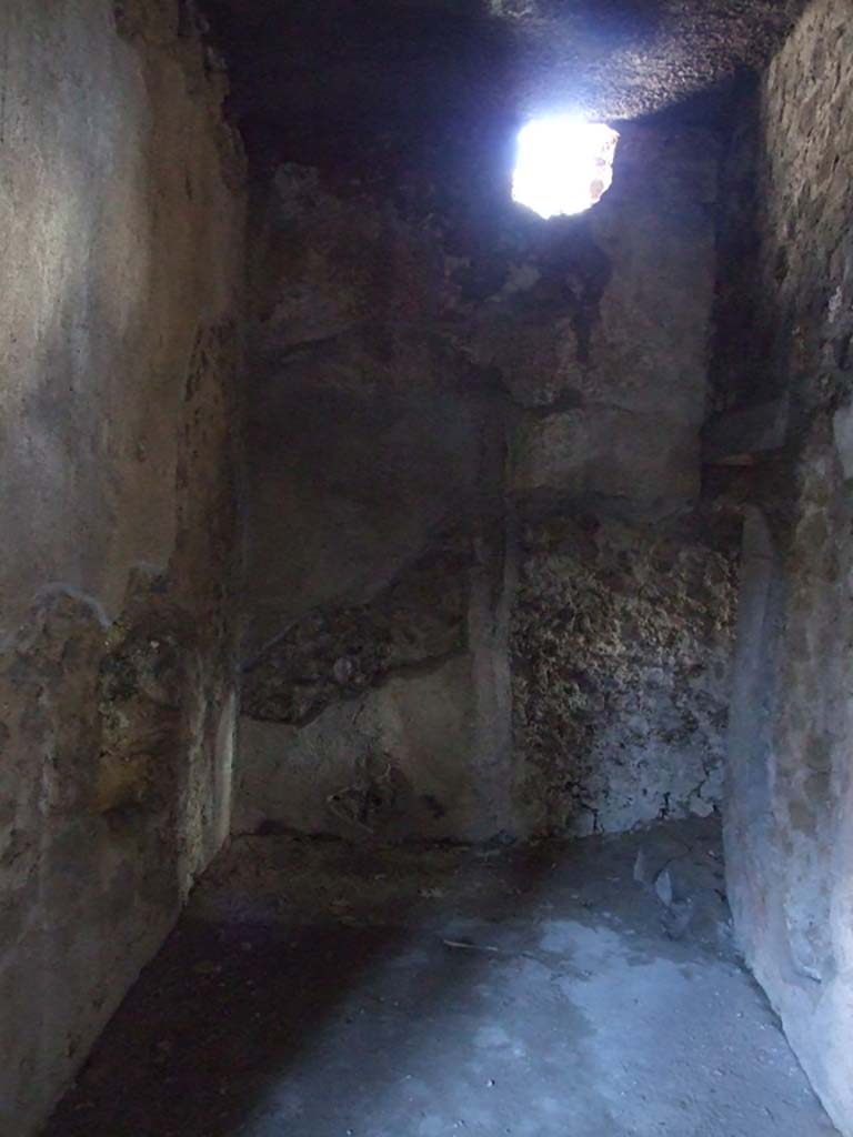 I.10.11 Pompeii. March 2009. Room 14, looking east along corridor leading to latrine.  