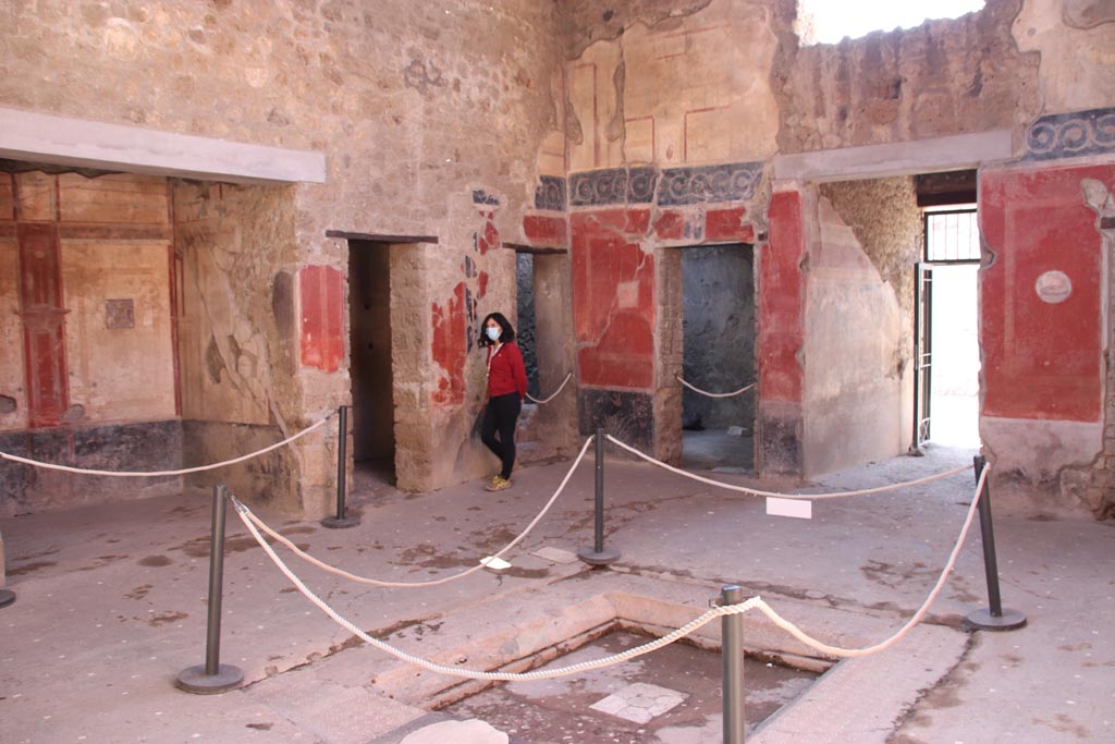 I.10.11 Pompeii. October 2022. Room 2, looking south-west across impluvium in atrium. Photo courtesy of Klaus Heese. 

