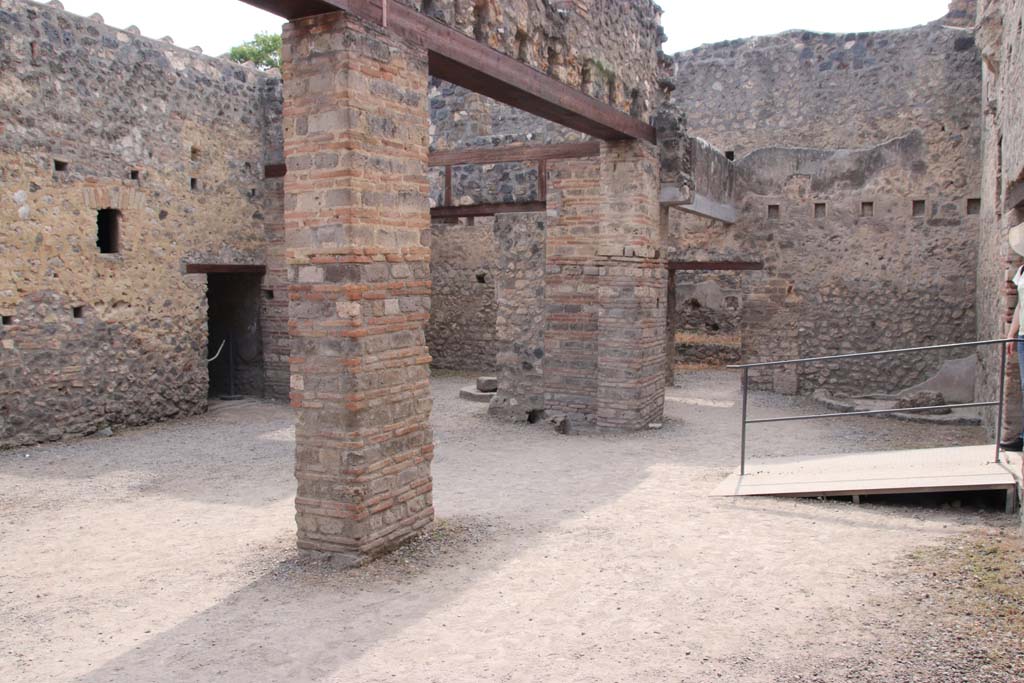 I.10.14 Pompeii. September 2021. 
Looking towards south-west corner and west wall, with doorway in north wall, on right. Photo courtesy of Klaus Heese.
