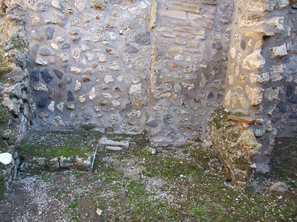 I.11.8 Pompeii. December 2006. Kitchen with site of stairs to upper floor on left, and site of latrine on right