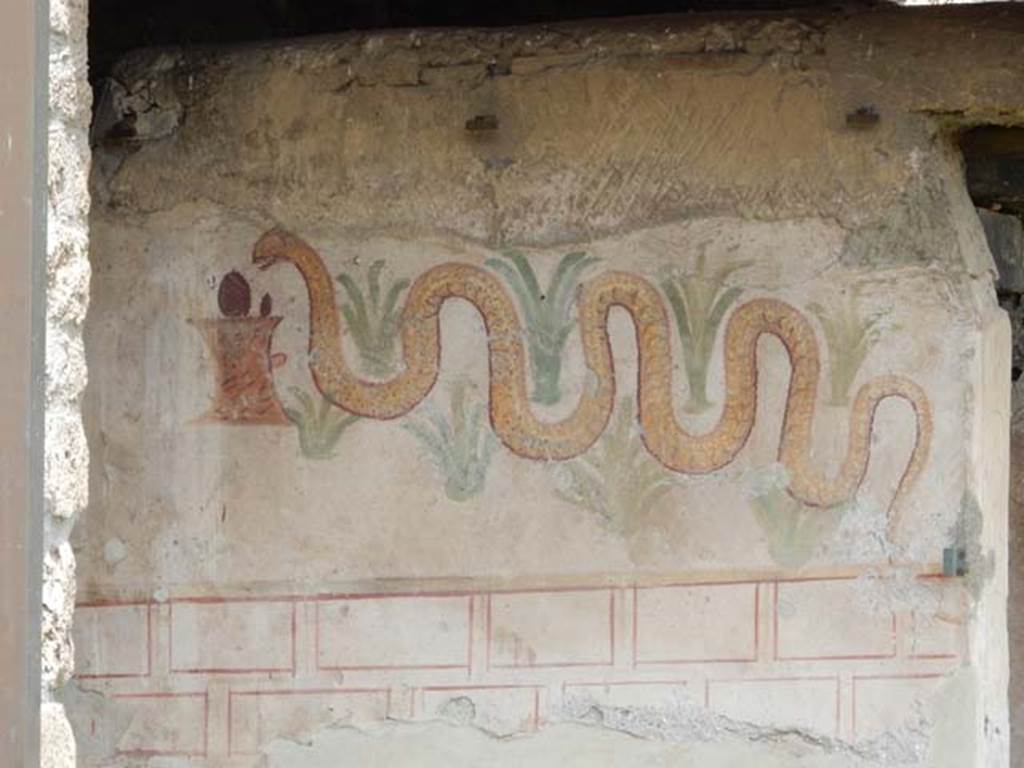 I.11.11 Pompeii. May 2017. Lararium painted on exterior south wall of latrine. Photo courtesy of Buzz Ferebee.
