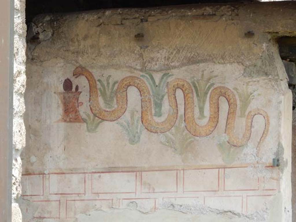 I.11.11 Pompeii. May 2017. Lararium painted on exterior south wall of latrine. Photo courtesy of Buzz Ferebee.