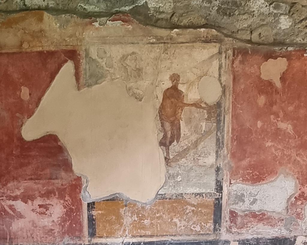 I.11.15 Pompeii. January 2023. Room 13, south wall with remains of the painting of Ariadne abandoned by Theseus. 
The figure of Ariadne was removed during the 1977 burglary. Photo courtesy of Miriam Colomer.
See Bragantini, de Vos, Badoni, 1981. Pitture e Pavimenti di Pompei, Parte 1. Rome: ICCD. (p.162).
