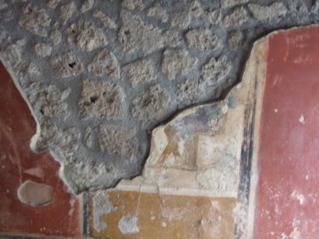 I.11.15 Pompeii.  December 2007.  Room 13.  Remains of wall painting with seated figure dressed in blue cloak.