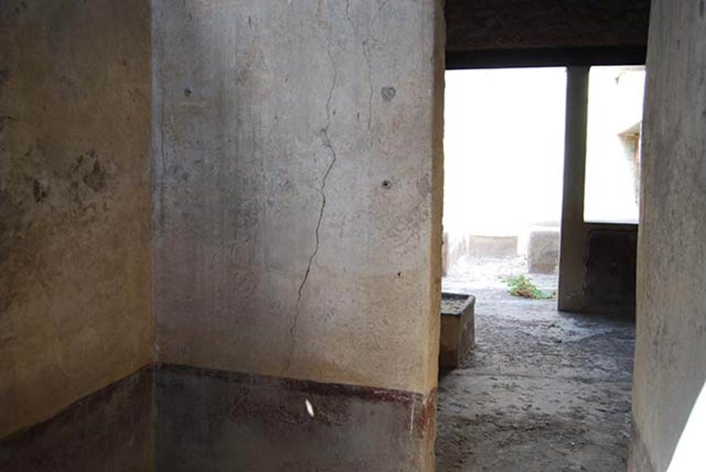 I.11.16 Pompeii. May 2103. Room 4, looking towards east wall with doorway to covered atrium.  Photo courtesy of Paula Lock.

