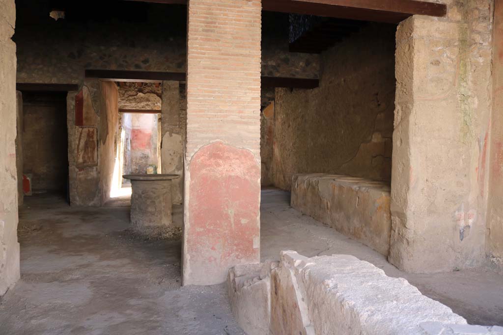 I.12.3 Pompeii. December 2018.
Room 1, looking south across counter towards painted pilaster, and rear rooms. Photo courtesy of Aude Durand.