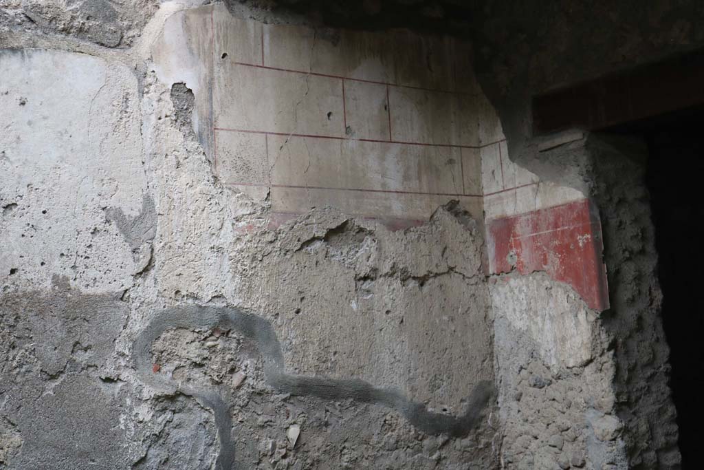 I.12.3 Pompeii. December 2018.
Looking towards west wall in north-west corner of garden, with remaining painted decoration. Photo courtesy of Aude Durand.