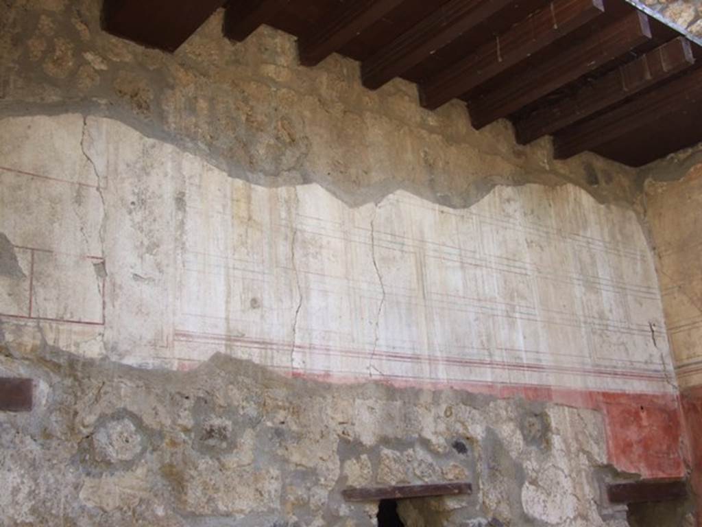 I.12.3 Pompeii. March 2009. Painted upper east wall of passageway.