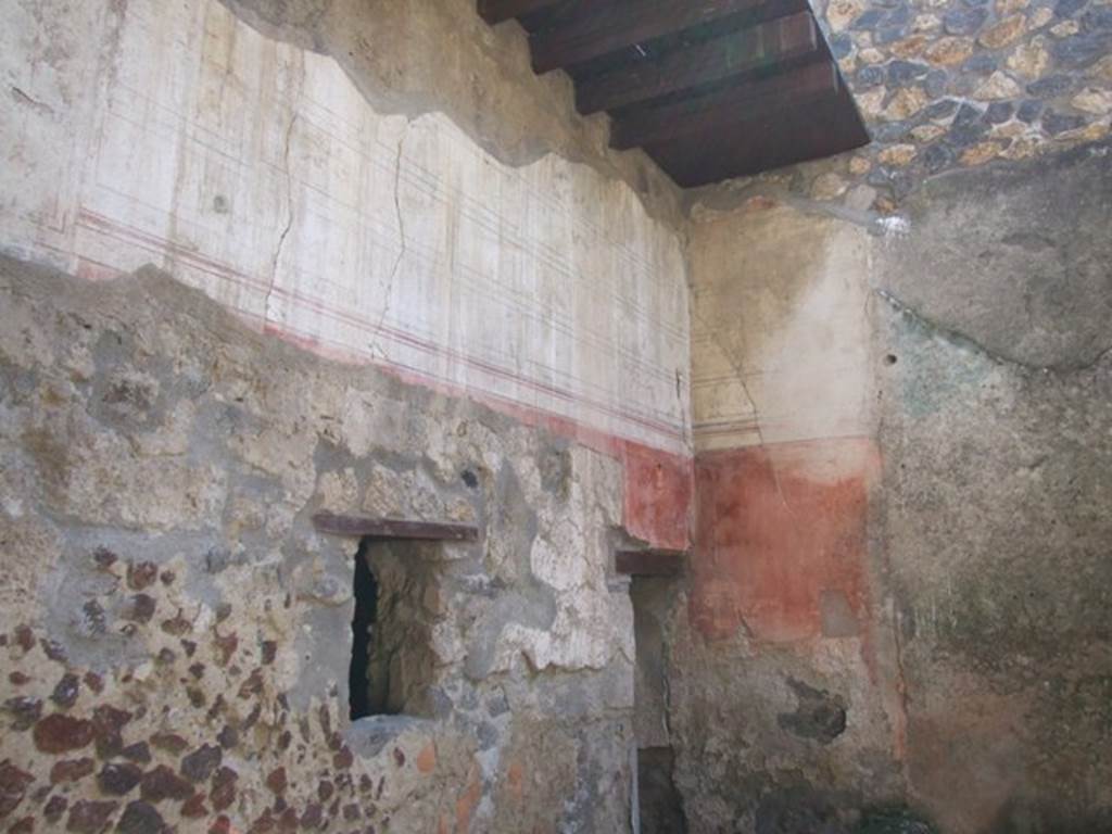 I.12.3 Pompeii. March 2009. South east corner of painted upper wall of passageway.
