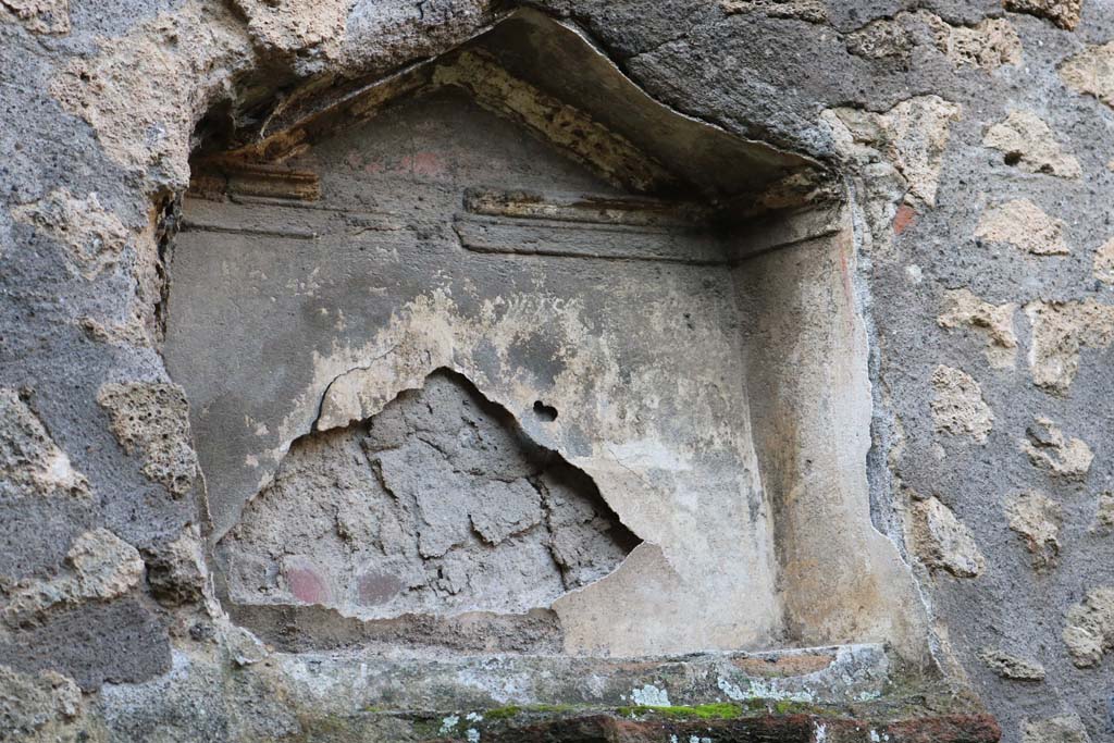 I.12.12 Pompeii. December 2018. Detail of niche of lararium in west wall. Photo courtesy of Aude Durand.