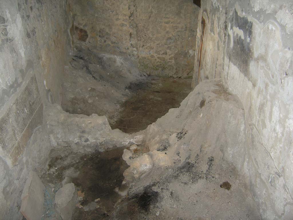 I.14.2 Pompeii. July 2008. Room I, cubiculum, looking south from room J. Photo courtesy of Guilhem Chapelin. 
At the far-left end is a mound of carbonized plants preserved in cubiculum I, south-east corner.
Voir Chapitre 2 : Latelier de fabrication de nattes de la via di Nocera (I 14, 2) in Magali Cullin-Mingaud, 2010. La vannerie dans l'Antiquit romaine: Collection du Centre Jean Brard 35. Paris. Centre Jean Berard, p. 129-171, fig. 196.
https://books.openedition.org/pcjb/706  

