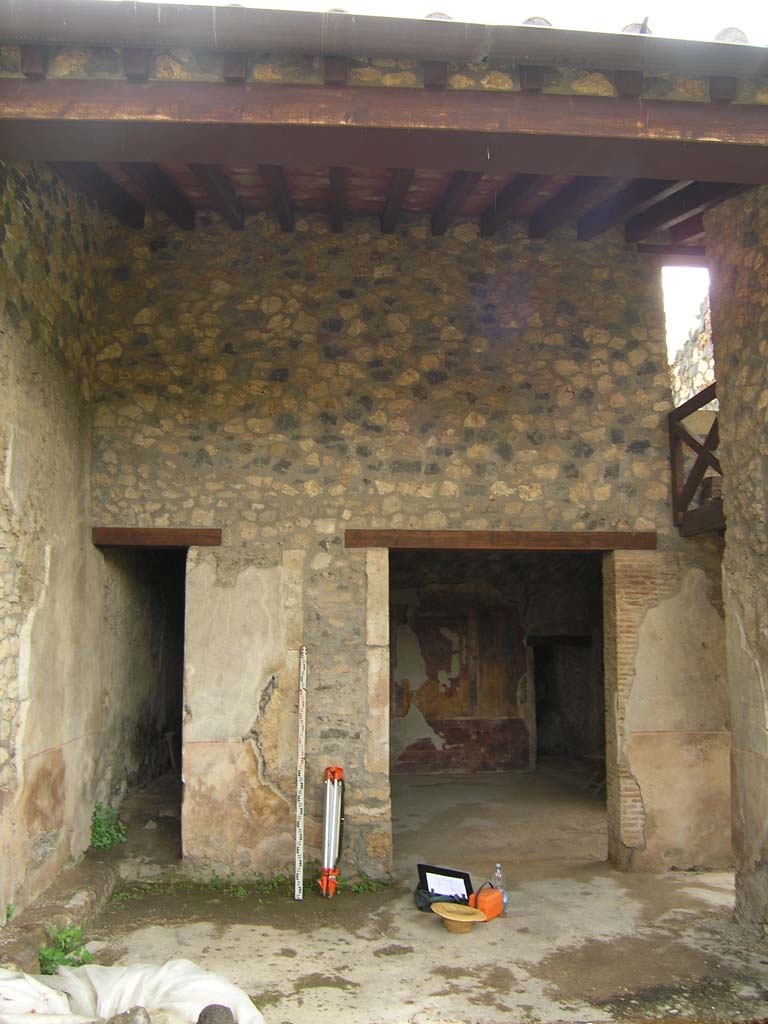 I.14.2 Pompeii. July 2008. Looking east to doorways to corridor K, and room H, in area L, on east side of garden area.  
Photo courtesy of Guilhem Chapelin. 
