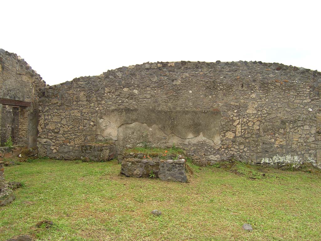 I.14.2 Pompeii. July 2008. Garden area M, looking towards south wall, and summer triclinium.
Photo courtesy of Guilhem Chapelin. 

