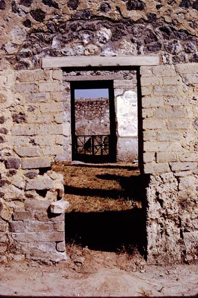 I.15.3 Pompeii. 1972. Looking north through doorway from garden area 14, onto south portico 10. 
Photo by Stanley A. Jashemski. 
Source: The Wilhelmina and Stanley A. Jashemski archive in the University of Maryland Library, Special Collections (See collection page) and made available under the Creative Commons Attribution-Non Commercial License v.4. See Licence and use details.
J72f0591

