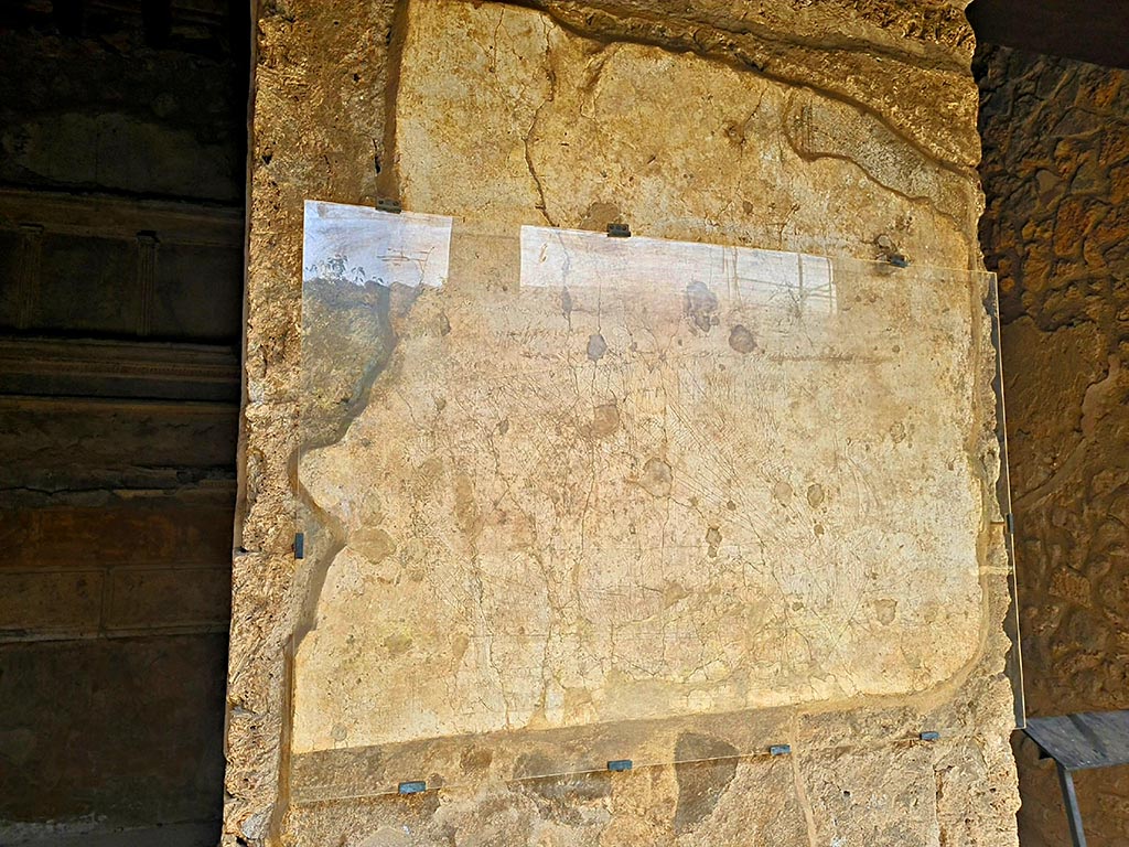 I.15.3 Pompeii. September 2024. North wall of portico 10, with drawing of ship and graffiti. Photo courtesy of Giuseppe Ciaramella.