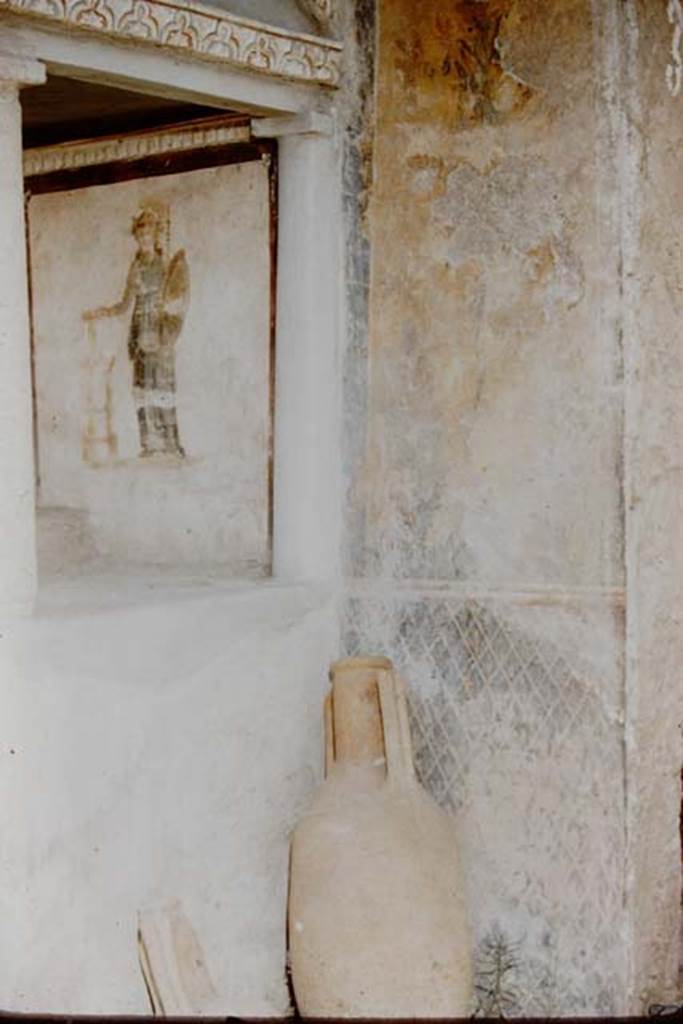 I.16.3 Pompeii. 1959. North wall in lararium. Detail of painting of Minerva, amphora and painted trellis. Photo by Stanley A. Jashemski.
Source: The Wilhelmina and Stanley A. Jashemski archive in the University of Maryland Library, Special Collections (See collection page) and made available under the Creative Commons Attribution-Non Commercial License v.4. See Licence and use details.
J59f0507

