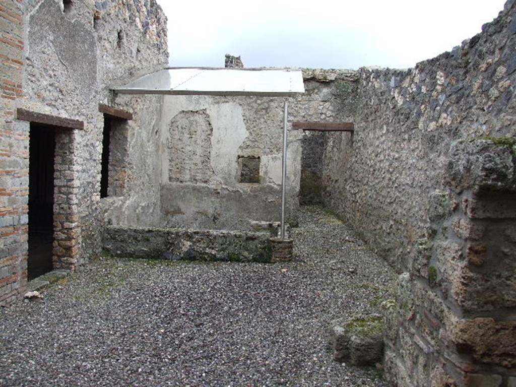 I.16.3 Pompeii. December 2006. Looking south across atrium with view of small garden.