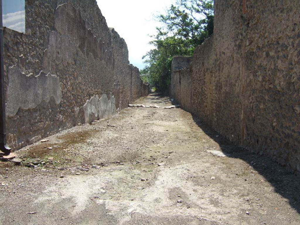 I.16.4 west side wall onto roadway, looking south. September 2005. I.17.
The subsidence in the roadway would be from the Sarno canal, below.