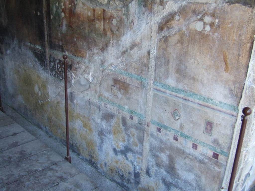 I.16.5 Pompeii. September 2005. Painted wall in room on east side of peristyle.