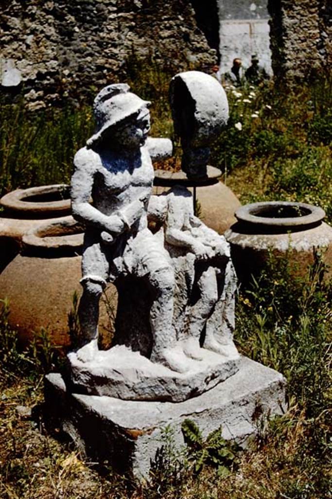 I.20.1 Pompeii. 1961. Statue of the gladiator found in this garden, on the base. Photo by Stanley A. Jashemski.
Source: The Wilhelmina and Stanley A. Jashemski archive in the University of Maryland Library, Special Collections (See collection page) and made available under the Creative Commons Attribution-Non Commercial License v.4. See Licence and use details.
J61f0529