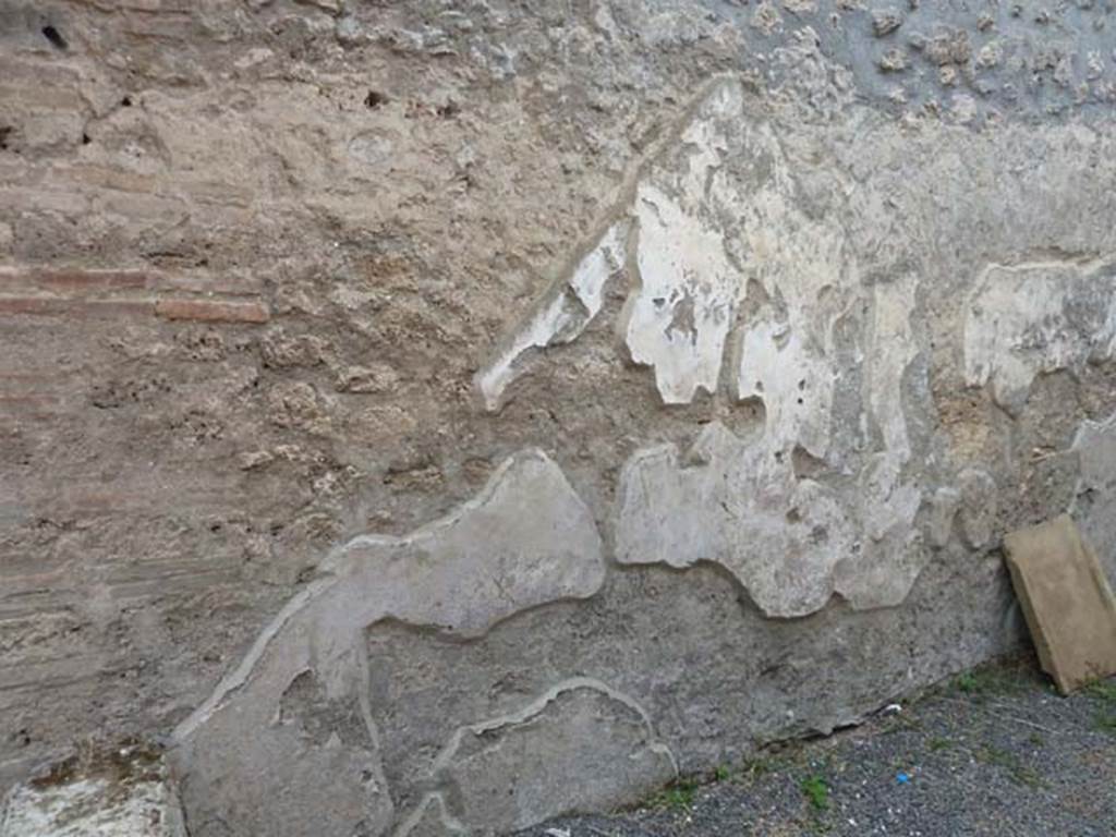 I.21.2 Pompeii. September 2015. West wall under stairs. The line of the (wooden) stairs can be seen in the remaining plaster, at the base of which (on the left) are the start of the stone steps.