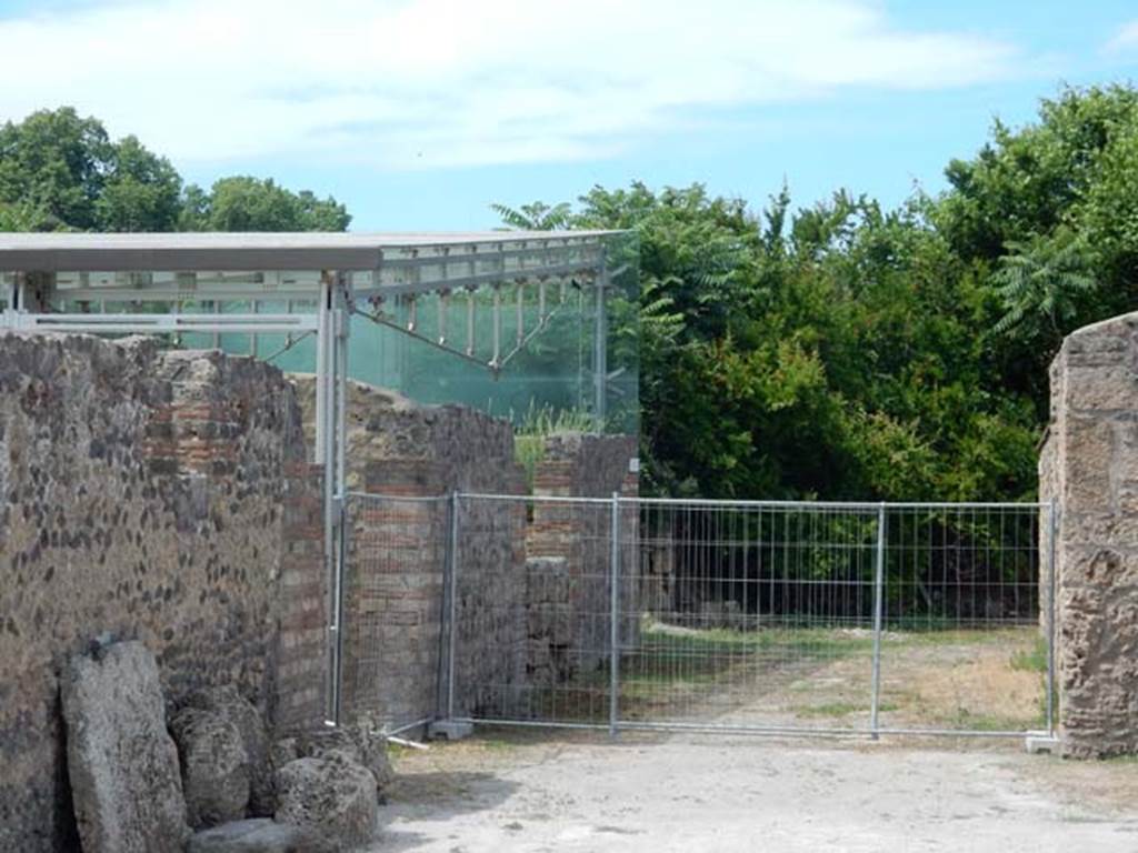 I.22.2 Pompeii. May 2017. Looking west along Via della Palestra, with entrance doorway, on left. Photo courtesy of Buzz Ferebee.

