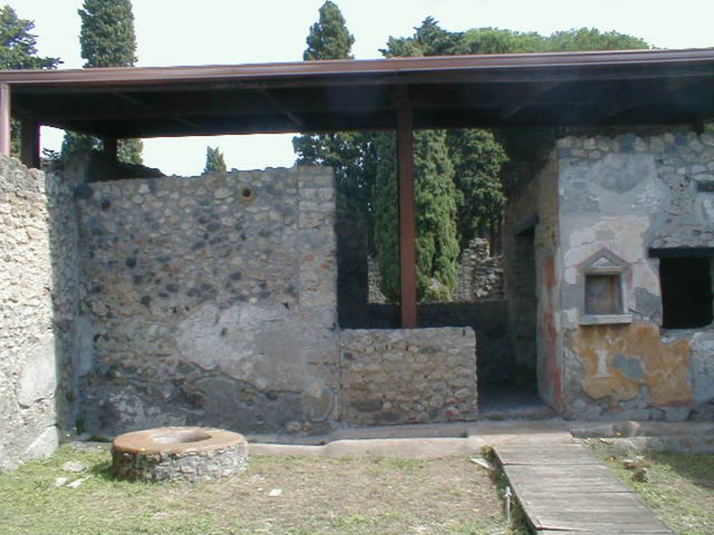 II.1.9 Pompeii. September 2004. North east corner with large well.