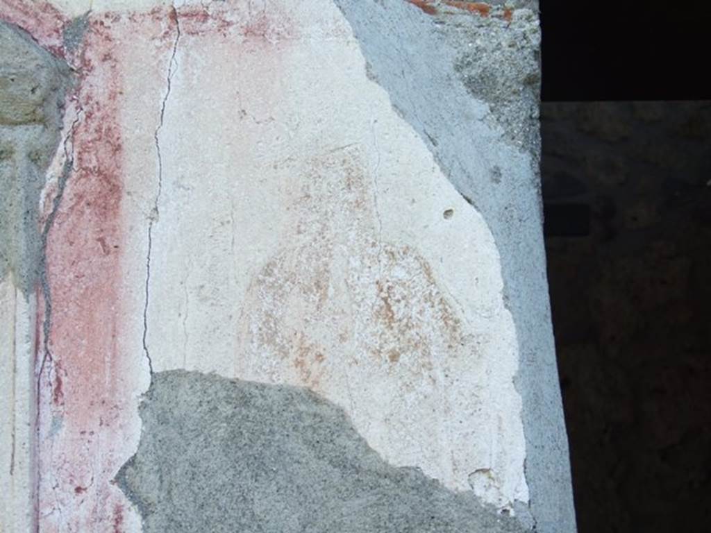 II.1.9 Pompeii. March 2009. Remains of painting of Hercules, on south side of niche, in red-bordered panel.