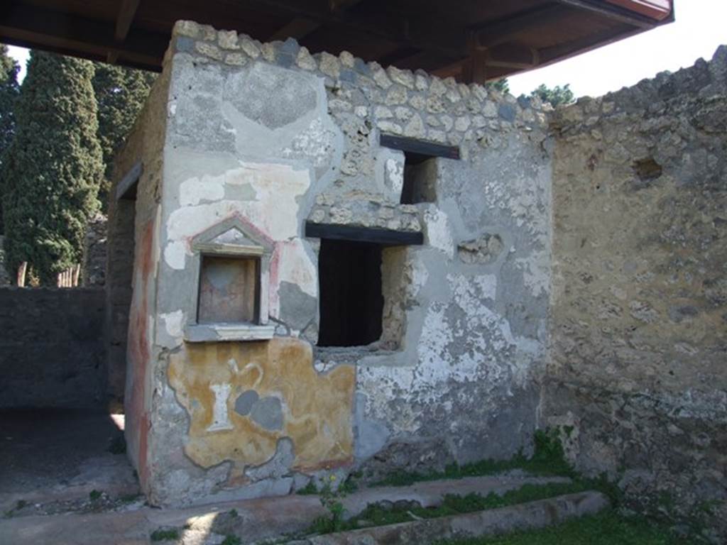 II.1.9 Pompeii. March 2009. East wall of courtyard garden, with niche Lararium with aedicula .