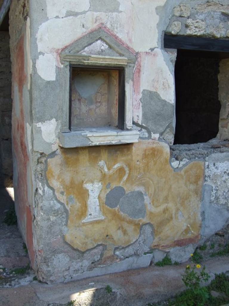 II.1.9 Pompeii. March 2009. Niche Lararium, with stucco altar and stucco serpent.
