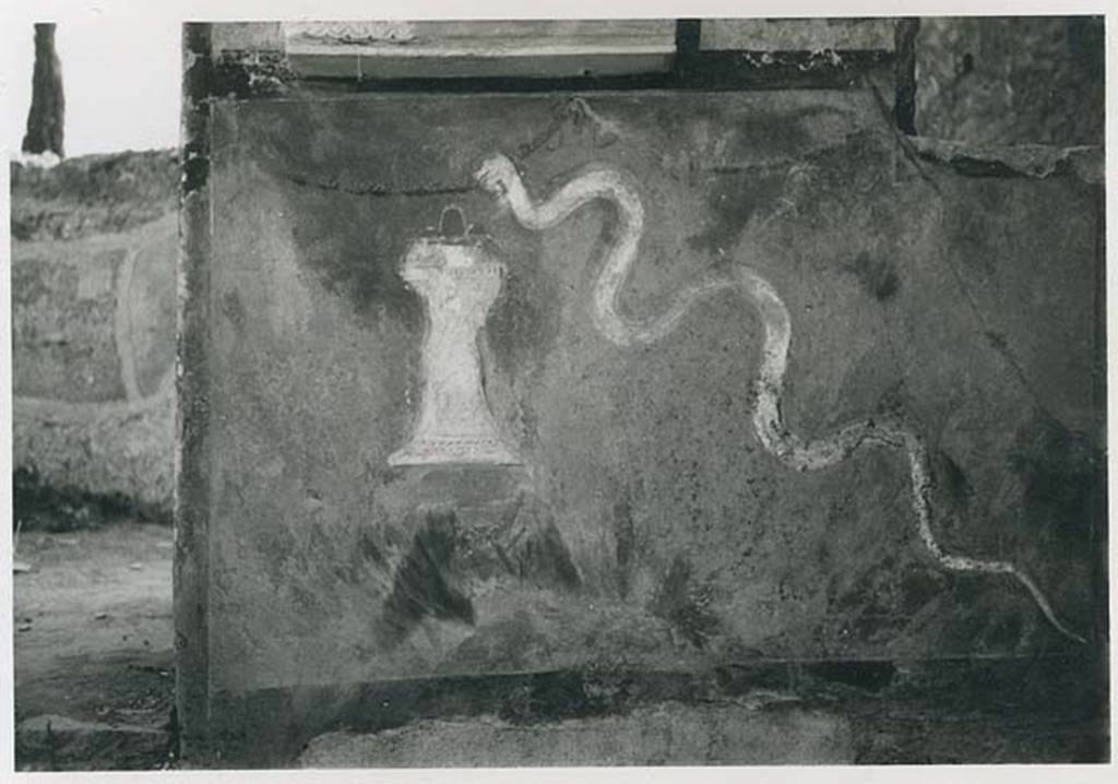 II.1.9 Pompeii. 1954. Lararium with stucco serpent and altar. Below the niche was a painting of a garden with a stucco altar and stucco crested serpent. Photo courtesy of Rick Bauer.