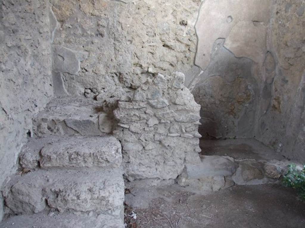 II.1.9 Pompeii. March 2009. Room 1, looking north to stairs to upper floor, and latrine on the east side.