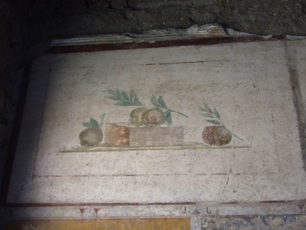 II.1.12 Pompeii. March 2009. Upper wall of south wall of triclinium with wall painting of pomegranates.
