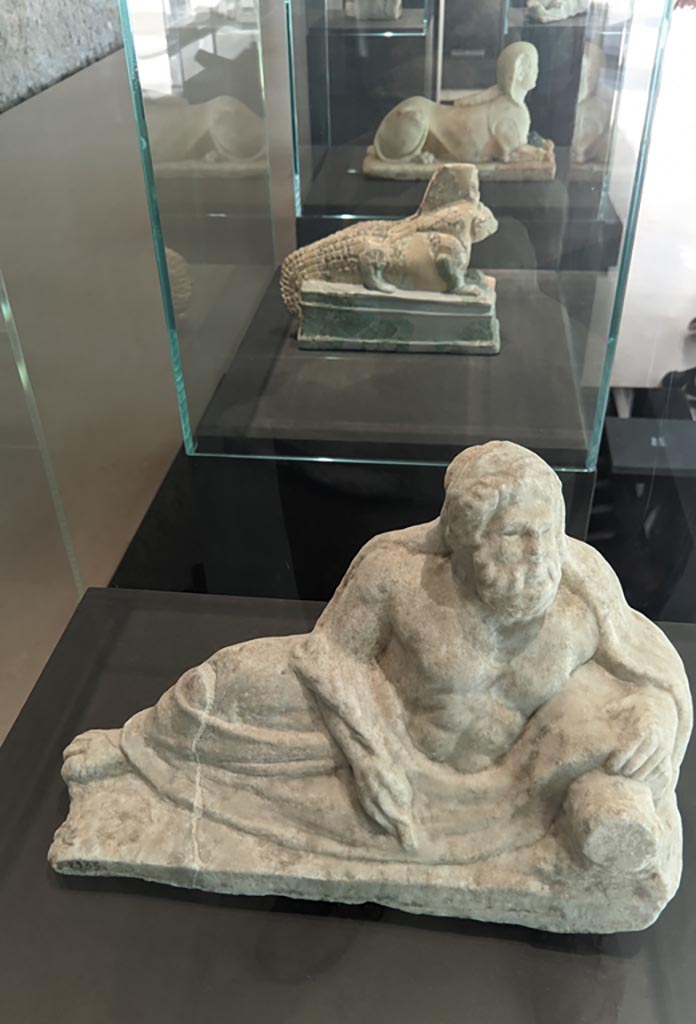 II.2.2 Pompeii. April 2022. 
Room “k”. White marble statuette of a river god. On display in exhibition in Palaestra.
Photo courtesy of Giuseppe Ciaramella.
