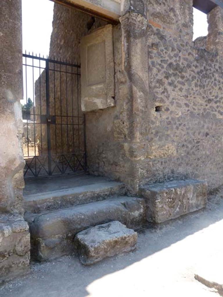 II.2.4 Pompeii. June 2012. Looking towards west side of entrance doorway, with plaster cast of remaining doorway. Photo courtesy of Michael Binns.
