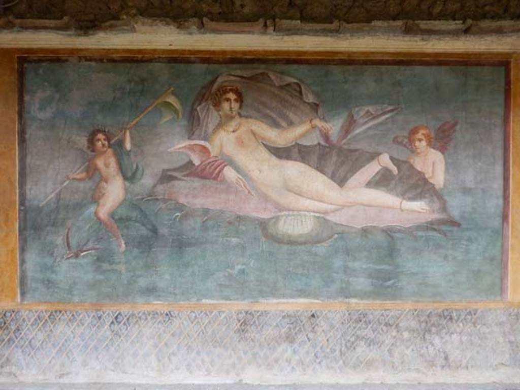 II.3.3 Pompeii. May 2016. Room 11, central panel of south wall with Venus/Aphrodite in a shell.
One amorino / cupid rides on a dolphin, the other is supporting the shell.
Photo courtesy of Buzz Ferebee.

