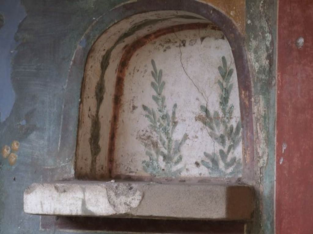 II.3.3 Pompeii. December 2006. Room 11, west panel on south wall of peristyle. Niche painted with plants.