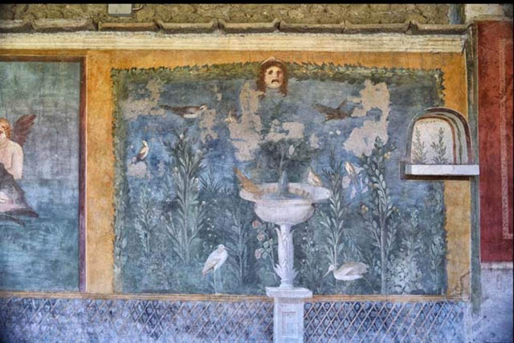 II.3.3 Pompeii. April 2018. Room 11, west panel of south wall of peristyle, wall painting of fountain with garden, mask and birds.
Photo courtesy of Ian Lycett-King. Use is subject to Creative Commons Attribution-NonCommercial License v.4 International.
