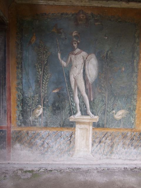 II.3.3 Pompeii. December 2006. Room 11, east panel on south wall of peristyle. Wall painting of statue of naked Ares / Mars with a lance and shield.

