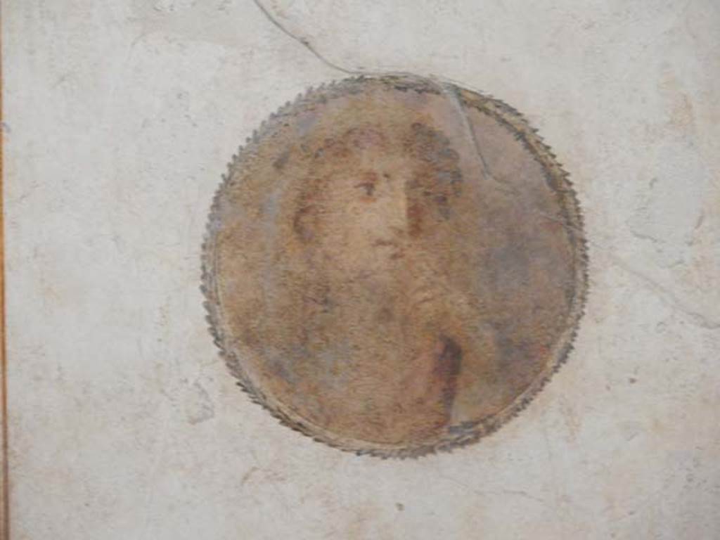 II.3.3 Pompeii. March 2009. Room 4, portrait medallion on north end of east wall.