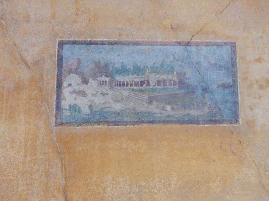 II.3.3 Pompeii. May 2016. Painted panel, architectural landscape, in north-east corner of room 11.
Photo courtesy of Buzz Ferebee.

