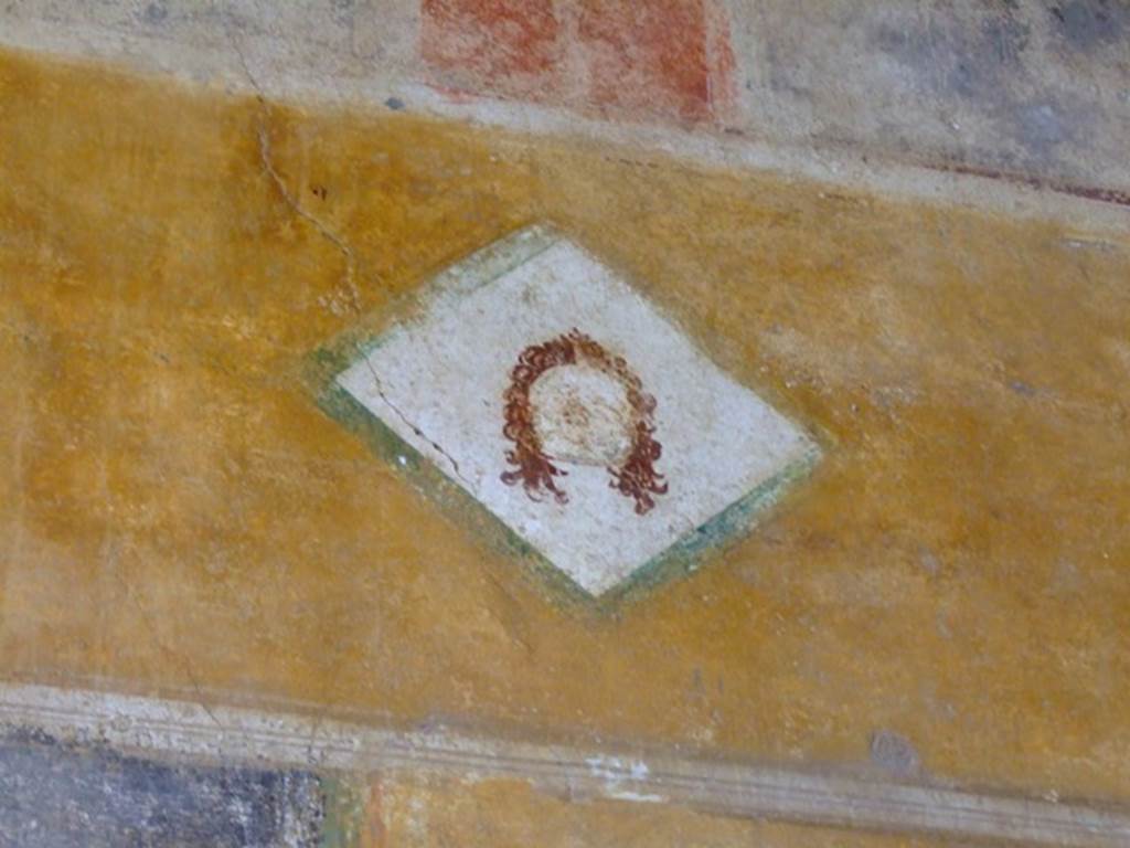 II.3.3 Pompeii. March 2009. Room 11, painted face on upper west wall of west portico, above doorway to room 12. 