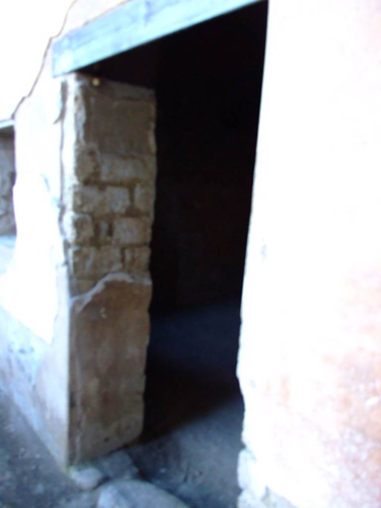 II.3.3 Pompeii.  March 2009. Doorway to Room 13.