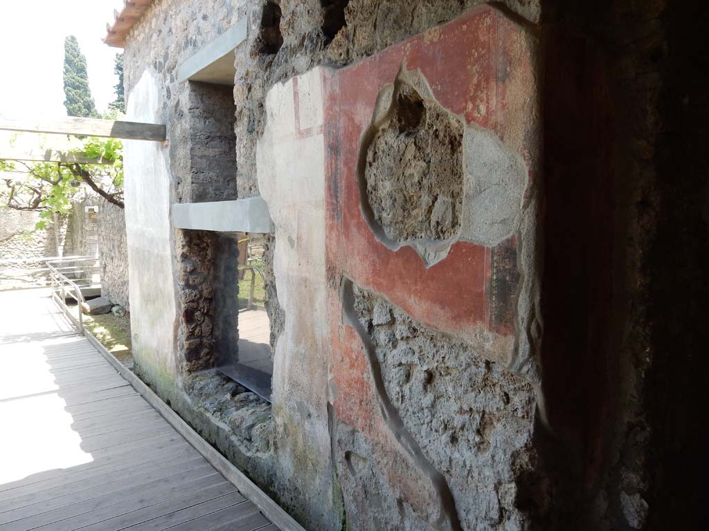 II.4.10 Pompeii. June 2019.  
Looking east towards exterior faade with window into biclinium, from near steps leading down into atrium from portico. Photo courtesy of Buzz Ferebee.

