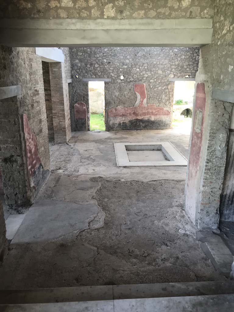 II.4.10 Pompeii. April 2019. Looking south across atrium, from west portico of II.4.6. Photo courtesy of Rick Bauer.  