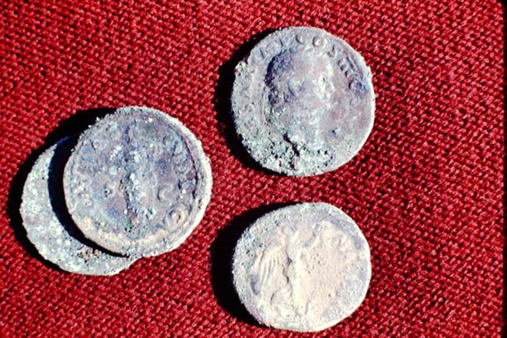 II.5 Pompeii, 1968. 4 coins found.  Photo by Stanley A. Jashemski.
Source: The Wilhelmina and Stanley A. Jashemski archive in the University of Maryland Library, Special Collections (See collection page) and made available under the Creative Commons Attribution-Non Commercial License v.4. See Licence and use details.
J68f1729
