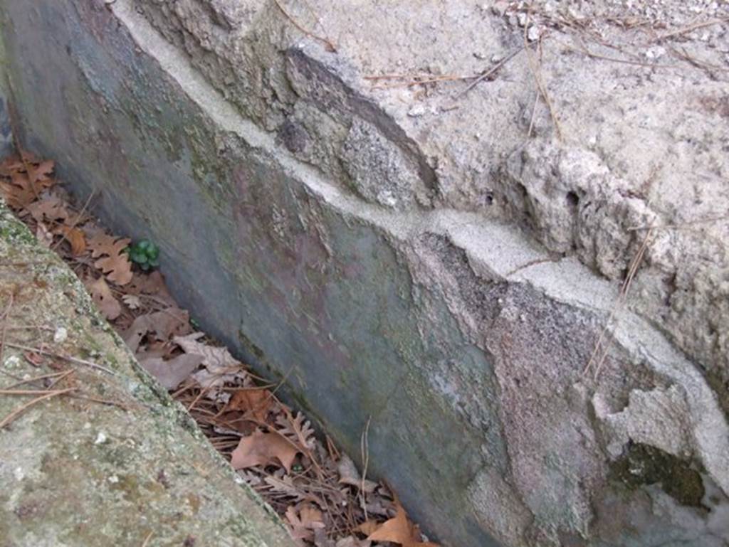 II.9.2 Pompeii. December 2007. Painted plaster with pygmy and boat scenes on triclinium.
According to Versluys, a boat with its prow shaped like an animal head is still visible, as well as other boats with pygmies, and a pygmy with a large shield who is defending himself against an ibis. At the time of excavation, also erotic scenes showing pygmies amid the rushes could be distinguished. There are paintings with the same subject in the adjacent house (II.9.4) and seem to have been painted by the same hand.
See Versluys M. J., 2002. Aegyptiaca Romana: Nilotic Scenes and the Roman Views of Egypt. Leiden: Brill, p. 111-2, no. 039. 
