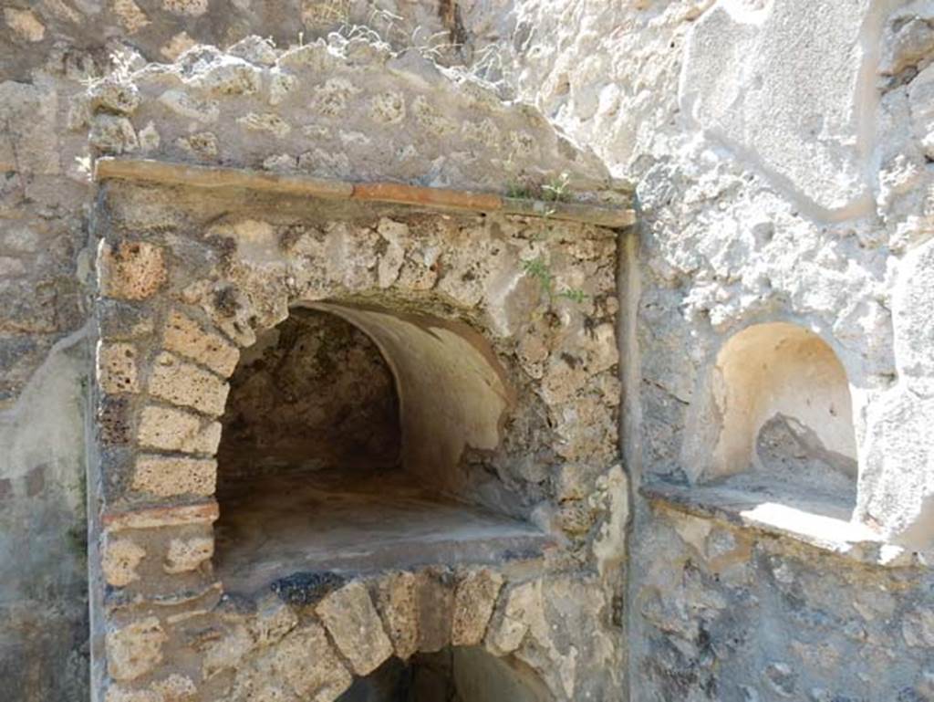 II.9.5 Pompeii, May 2018. 
Peristyle 6, household shrine/lararium against west wall and niche in north wall. Photo courtesy of Buzz Ferebee.
