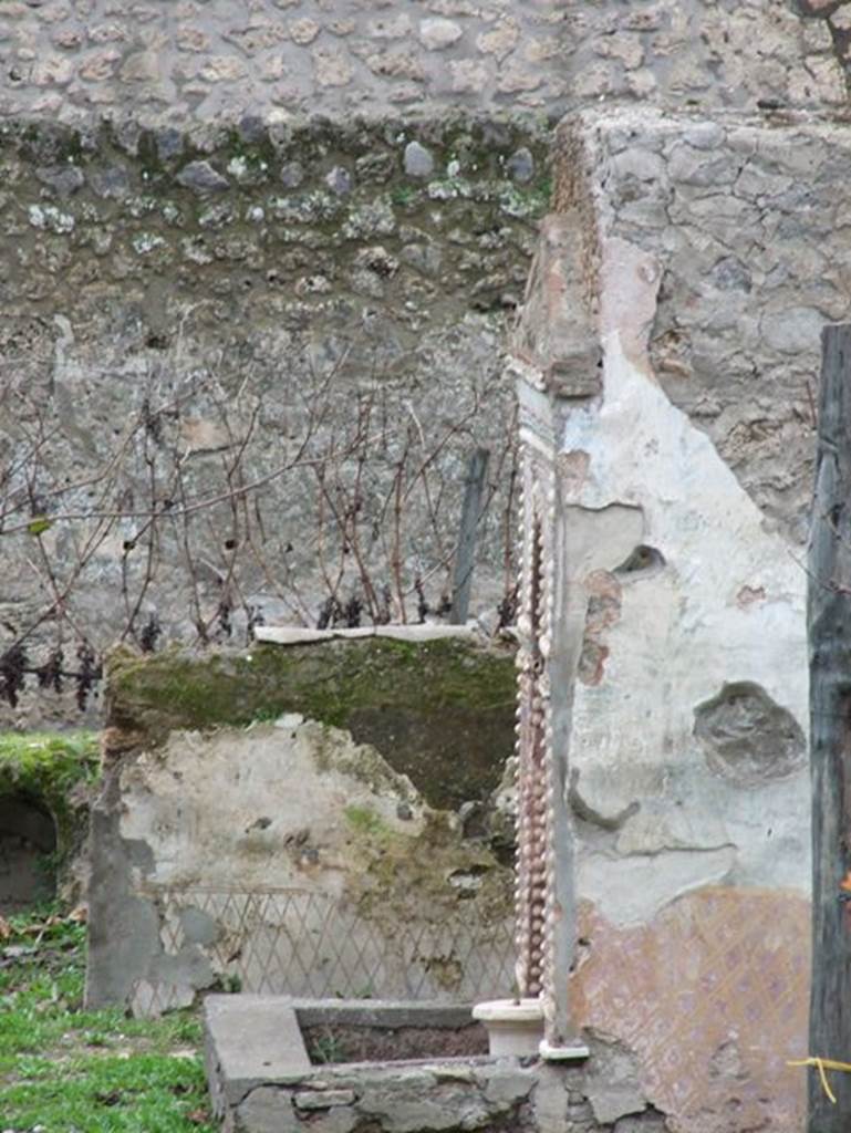 II.9.7 Garden entrance to House of Summer Triclinium.  December 2006.
East wall of north mosaic fountain.


