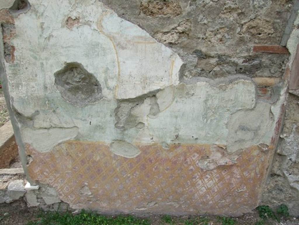 II.9.7. Garden entrance to House of Summer Triclinium.  December 2007.  East face of north fountain.  Painted trellis pattern and urn.